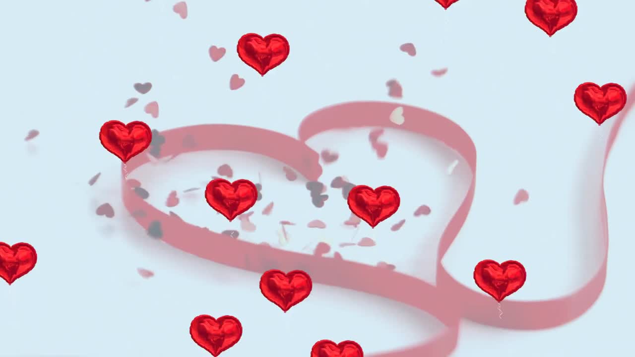 여러 개의 빨간색 심장 모양의 풍선이 여러 개의 심장 모양의 리본에 떨어지는 것에 대해 떠다니고 있습니다.