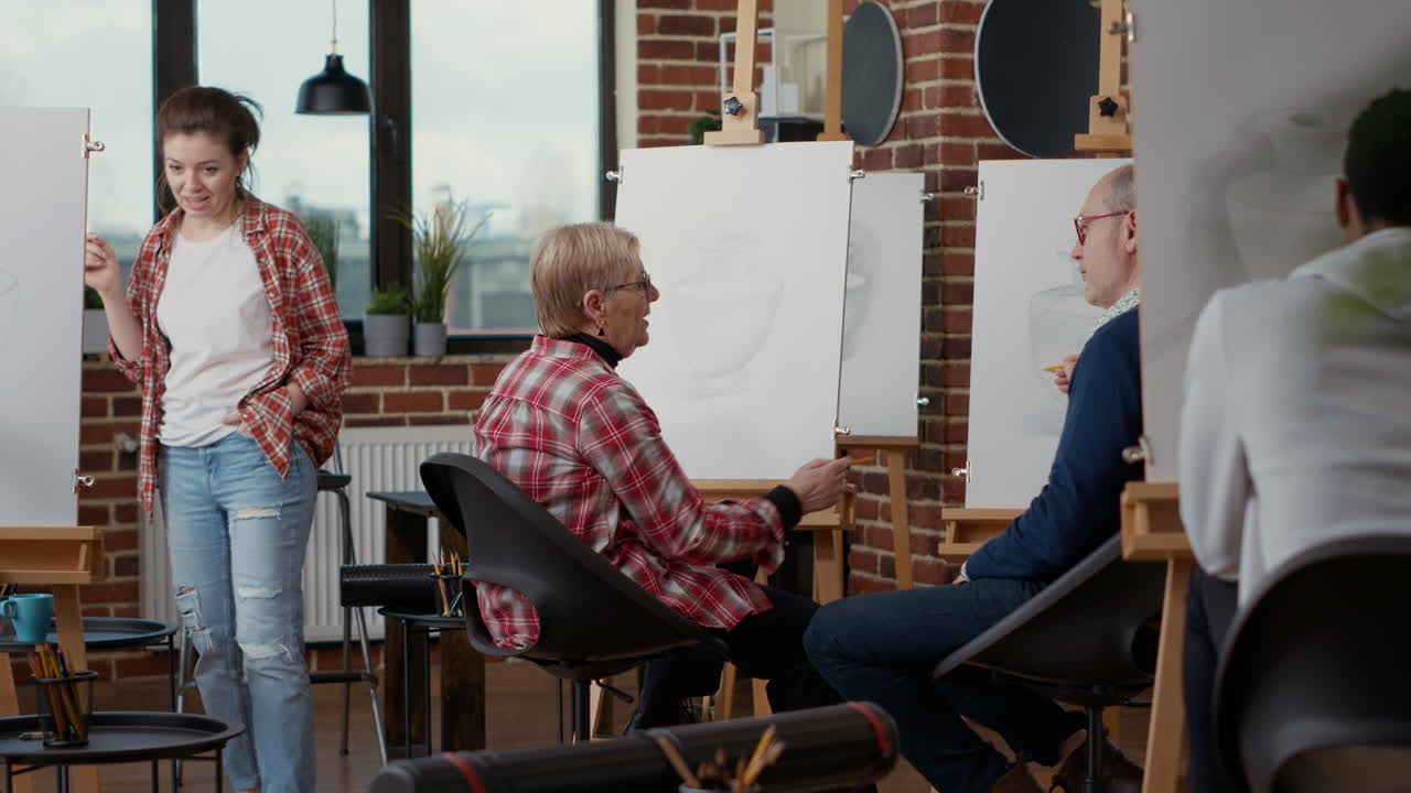 Senior man and woman attending community centre art class