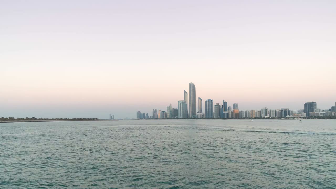 4K Timelapse - City Skyline and cityscape at sunset in Abu Dhabi.UAE