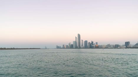 4k timelapse - city skyline and cityscape at sunset in abu dhabi.uae