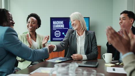business meeting with handshake and discussion about machine learning