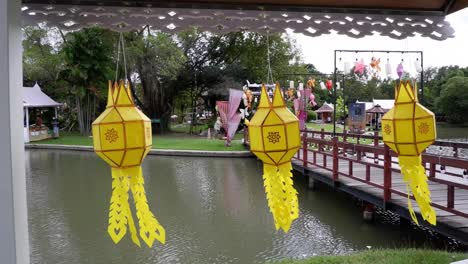 yellow lanterns gently moving above water