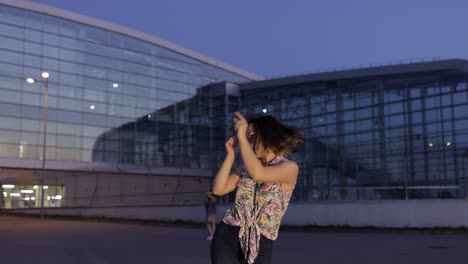 happy woman tourist dancing, having fun, enjoying dance, celebrating success, party music. evening