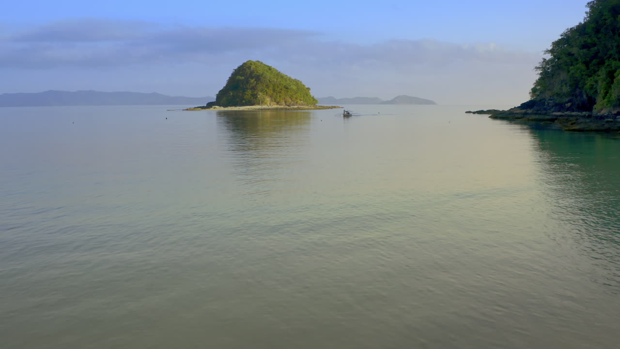 Couple Walking on a Tropical Beach with an Island View
