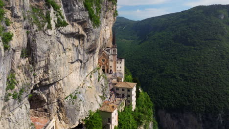 cliffside sanctuary of madonna della corona in the province of verona, italy. aerial drone shot