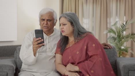 Angry-Old-Indian-couple-shouting-on-video-call