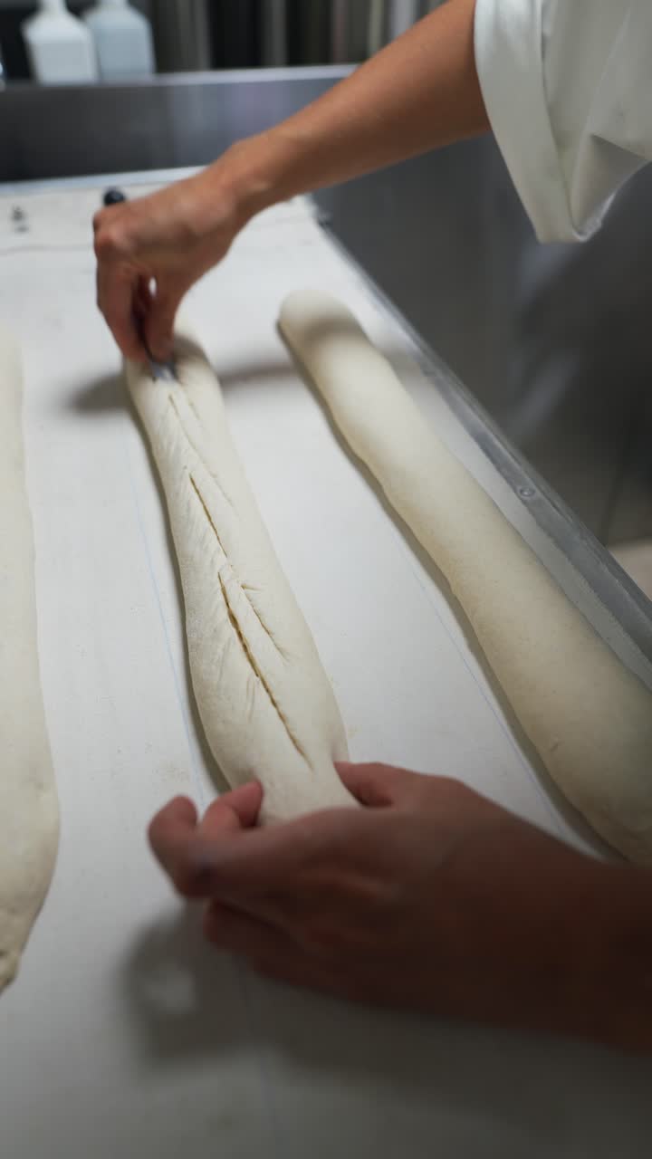 Baker preparing baguettes