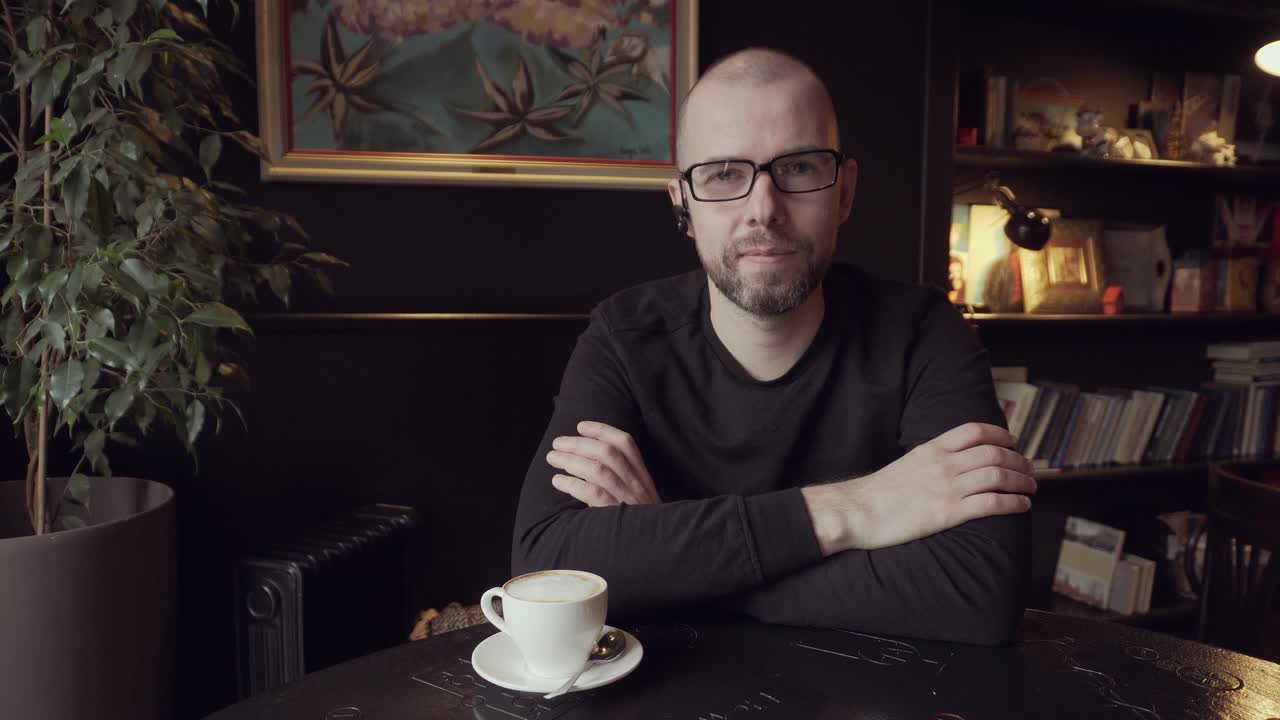 Man sitting in a cafe with coffee