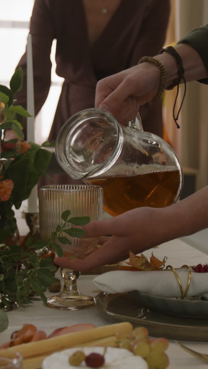 Pouring Juice at Thanksgiving Dinner