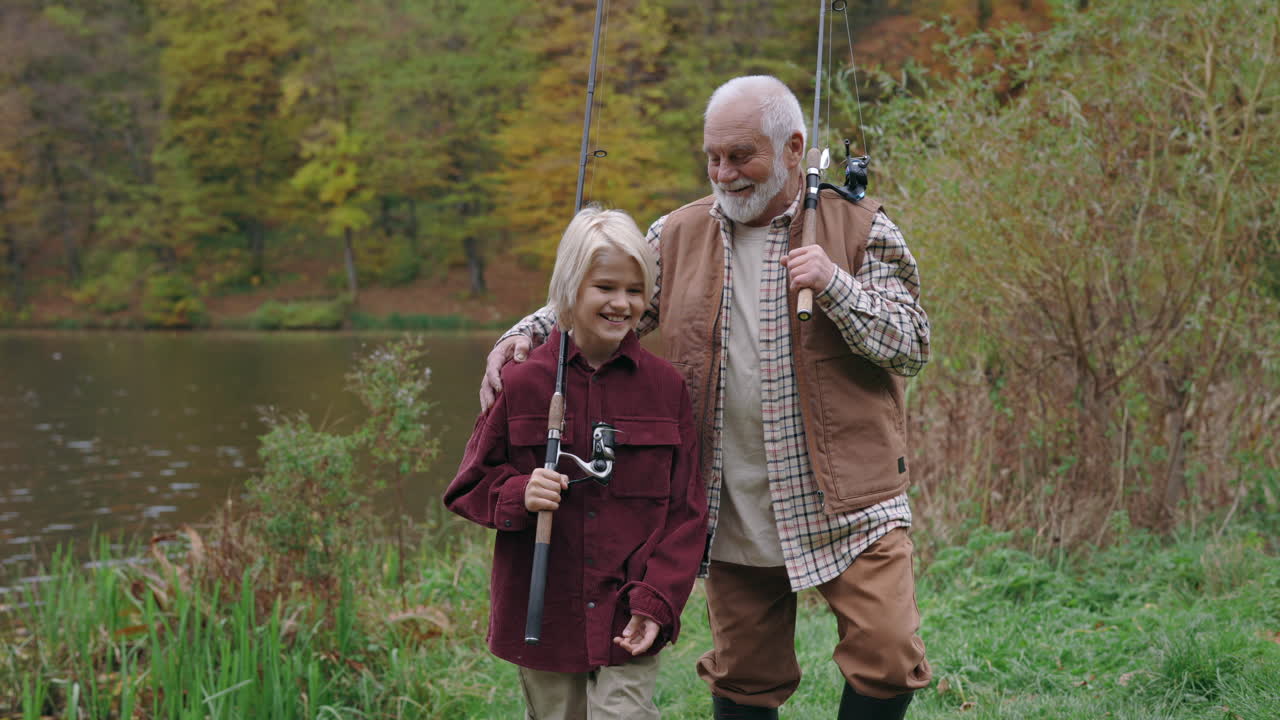 Grandfather and Grandson Enjoying a Fishing Trip by the Lake in Autumn
