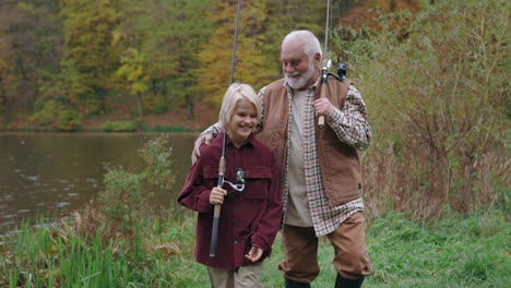 grandfather and grandson enjoying a fishing trip by the lake in autumn