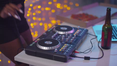 sequence of black woman djing at house party
