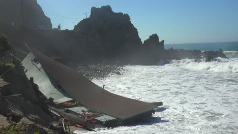 a house along the malibu coastline collapses into the sea after a major storm surge 7