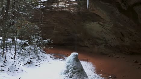 waterfall gets frozen during winter in ash cave, hocking hills state park in south bloomingville, ohio, usa