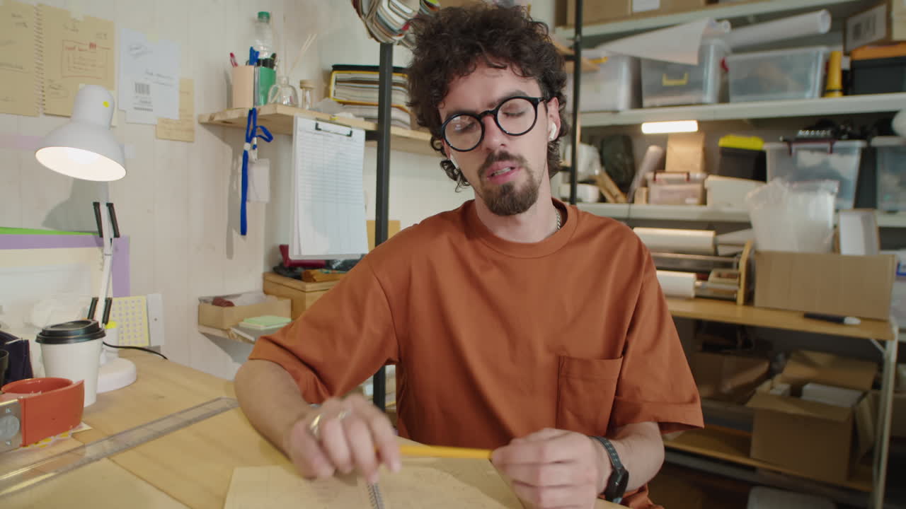 Man Talking on Camera via Web Call in Delivery Service Office
