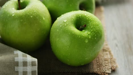 green wet apples in drops