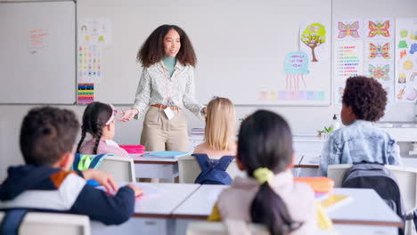 School,-answer-and-teacher-with-students