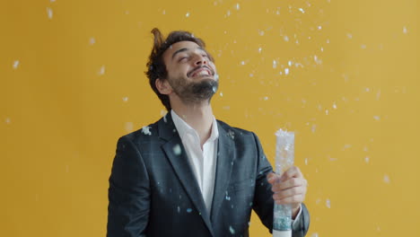 man celebrating with confetti