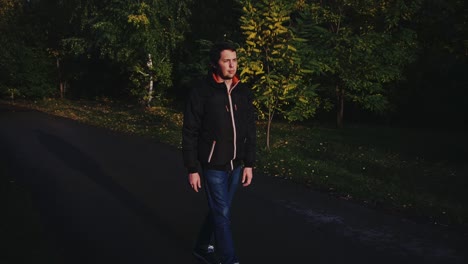 man walking in autumn park