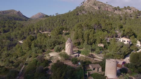 Wide-shot-of-Moli-de-Sa-Planeta-windmill-at-Mallorca-island-during-day-time,-aerial