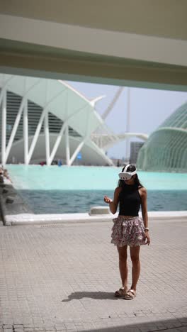 woman wearing vr headset in a modern city park