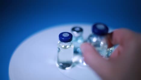 antivirus bottles spinning, a woman takes one bottle