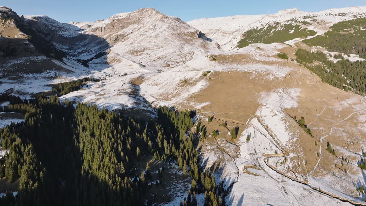 Aerial drone view of a little snow on the Bucegi Mountains, near Brasov, Romania