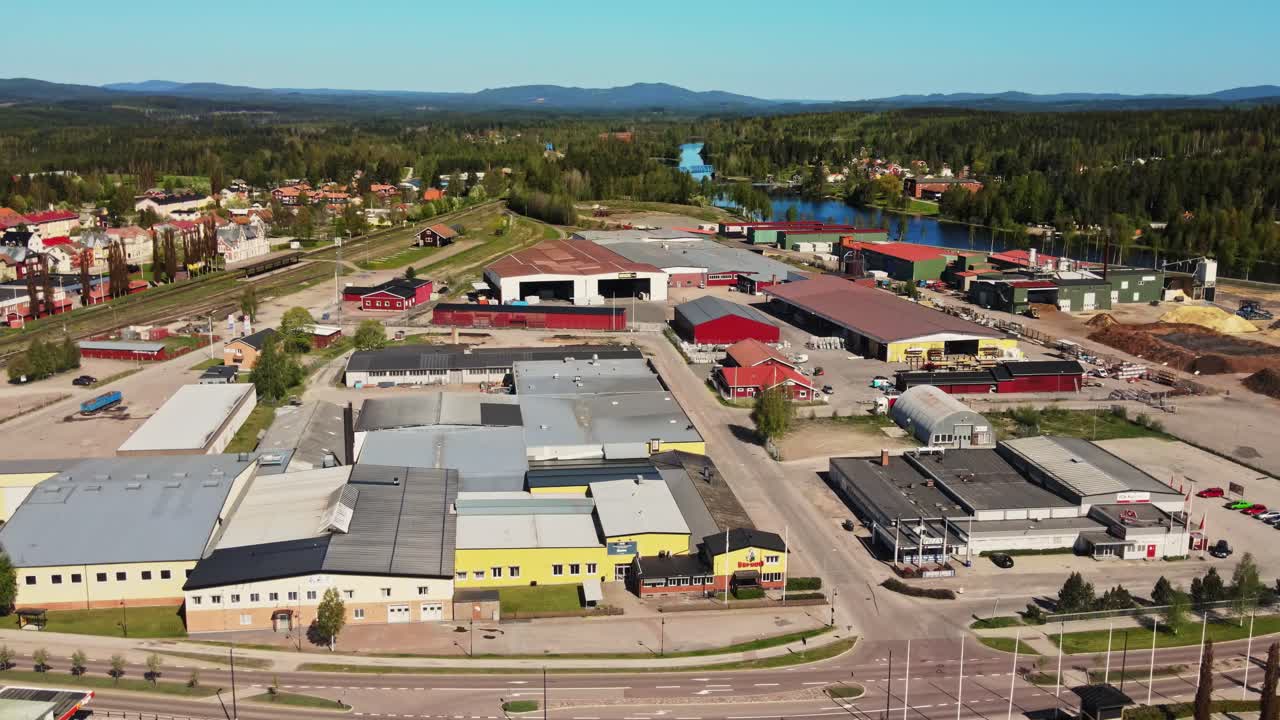 Factory Buildings At The Waterfront Of Vanan River In Vansbro, Dalarna, Sweden. aerial
