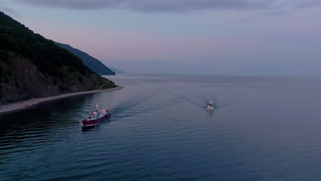 boats on a lake at sunset