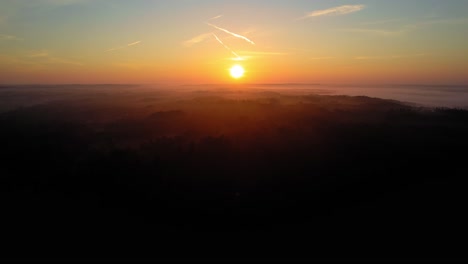 aerial - beautiful sunset over veluwe national park, netherlands, rising shot