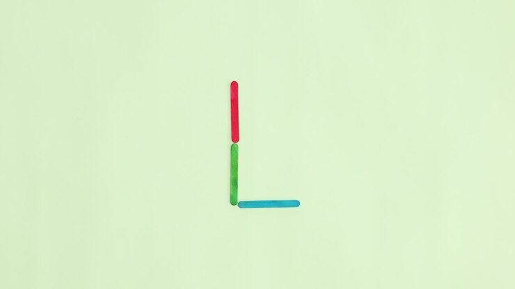 Alphabet letters appear on light green background. Stop motion