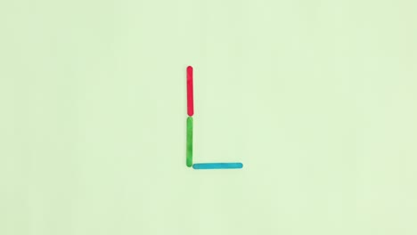 alphabet letters appear on light green background. stop motion