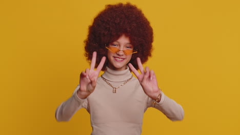 happy teenager child girl kid showing victory sign, hoping for success and win, doing peace gesture