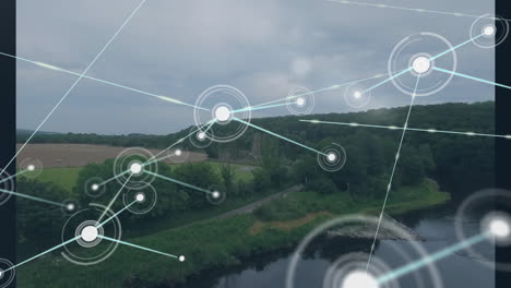 animation of network of connections with icons over mountain landscape