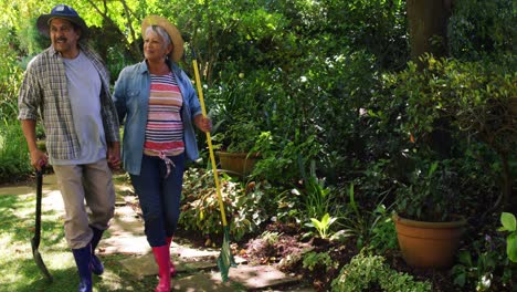 senior couple walking in garden