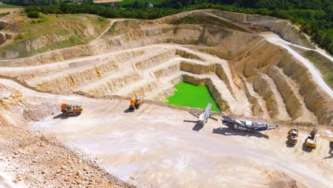 Turquoise Quarry Lake In Limestone Mine - aerial drone shot