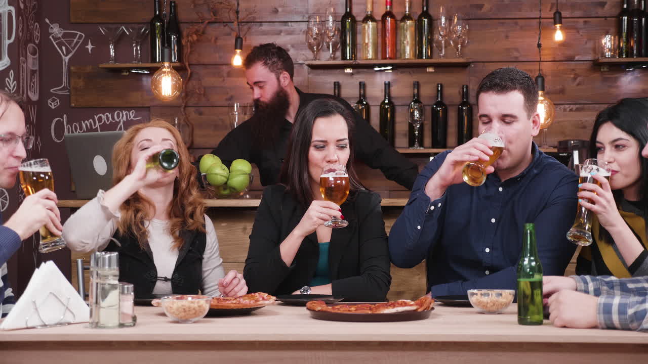 People enjoying dinner and drinks in a restaurant