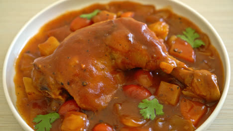 homemade-chicken-stew-with-tomatoes,-onions,-carrot-and-potatoes-on-plate