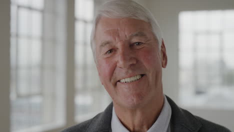 portrait-of-elderly-caucasian-man-laughing-enjoying-success-looking-at-camera-in-apartment-room-background-senior-male-retirement-slow-motion