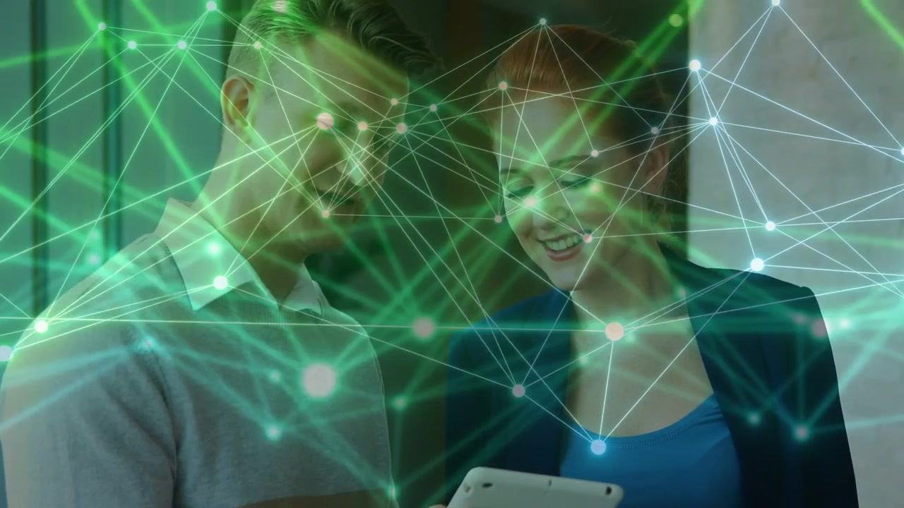 Team reviewing business data on white tablet, teal network overlaying pair highlighting insights