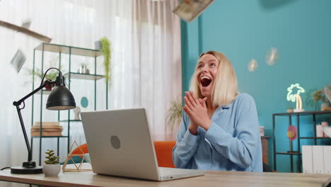 happy woman celebrating financial success, throwing money in the air