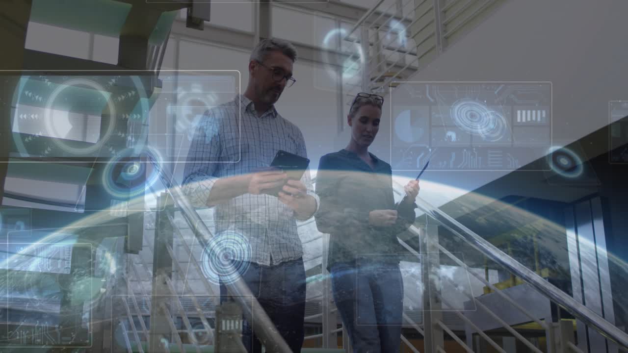 Colleagues descending stairs consulting devices causing holo globe HUD blooming reviewing tech data