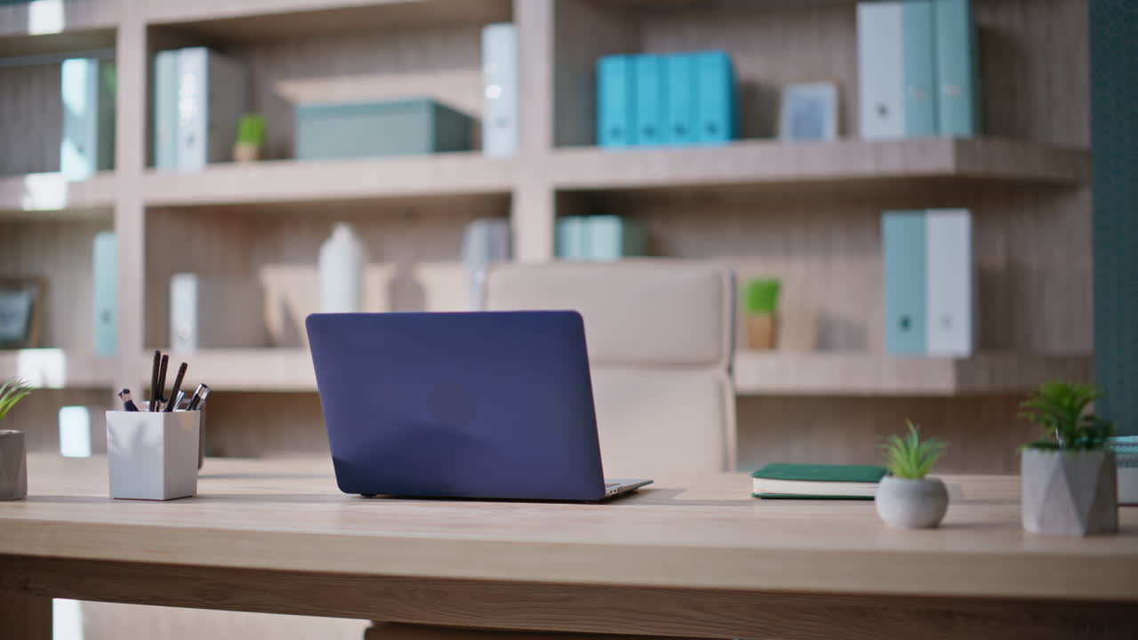 Contemporary minimalist office environment. Laptop standing at wooden desk