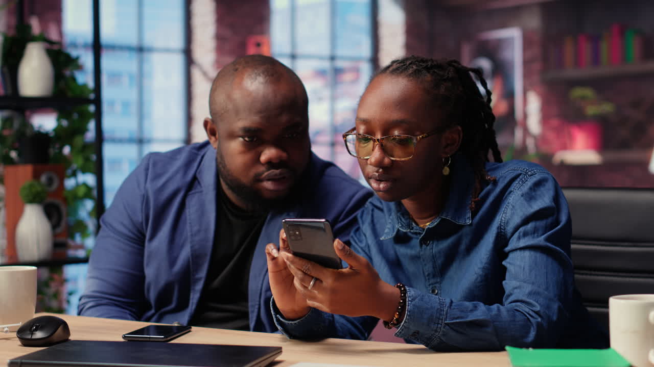 African american man and woman solving freelance tasks at home