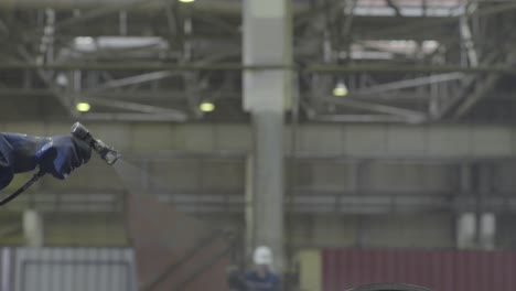 industrial painting and processing in a factory setting