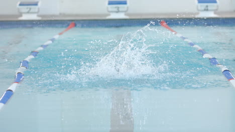 swimmer in action at a pool during training