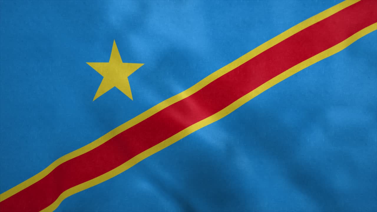 la bandera de la república democrática del congo soplando en el viento.