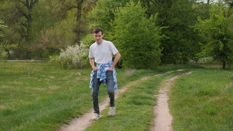 man walking through a spring park