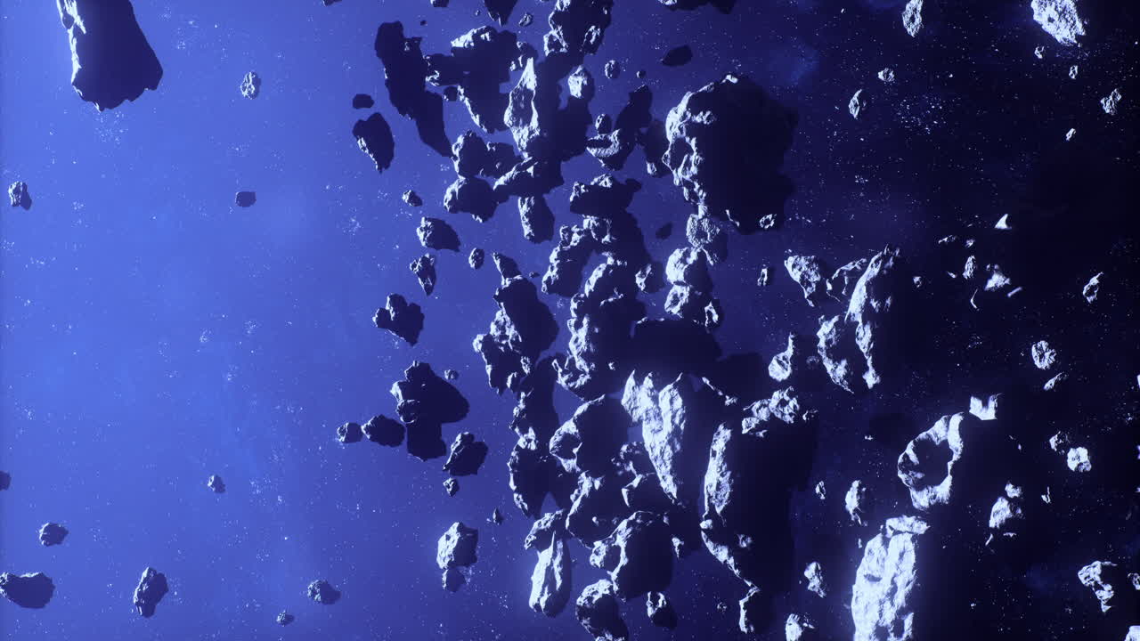 Asteroids drift through the vast emptiness of space in a cosmic show