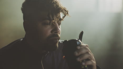 man drinking water after exercise